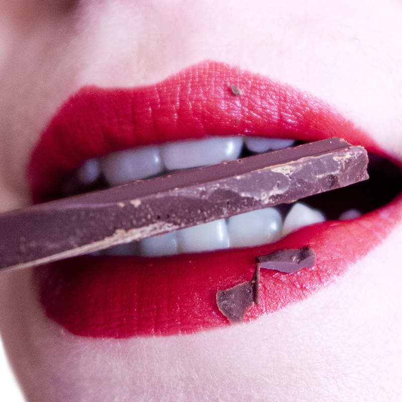 woman-biting-on-chocolate